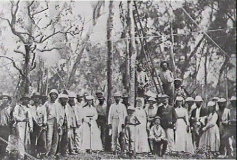 On the fifteenth of September, 1870, people lined up to be photographed at the planting of the first telegraph pole near Palmerston in Australia.