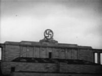 Swastika_blasted_from_the_Nazi_party_rally_grounds_-_Nuremberg_(1945)The U.S. Army blew the swastika from the top of the Zeppelintribüne on 25 April 1945, shown in this sequence of Army